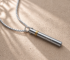Classic Harmonica breathing necklace by classickra on a neutral textured surface
